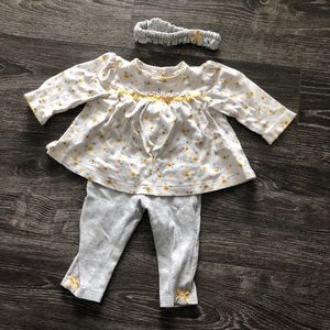 White top w/ yellow floral design & grey leggings